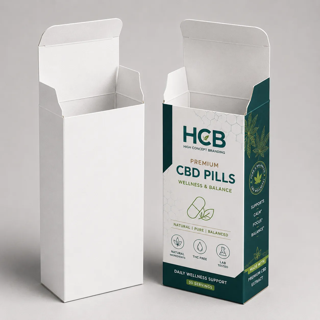 Open white cardboard tuck top boxes with custom green branding for CBD pill packaging.